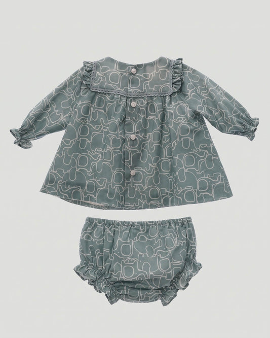 Back view of traditional Spanish baby dress featuring button closure and elasticated bloomers in duck green print.