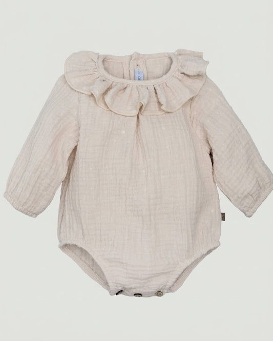 Calamaro traditional Spanish baby romper in cream double gauze plumeti fabric with ruffle collar.