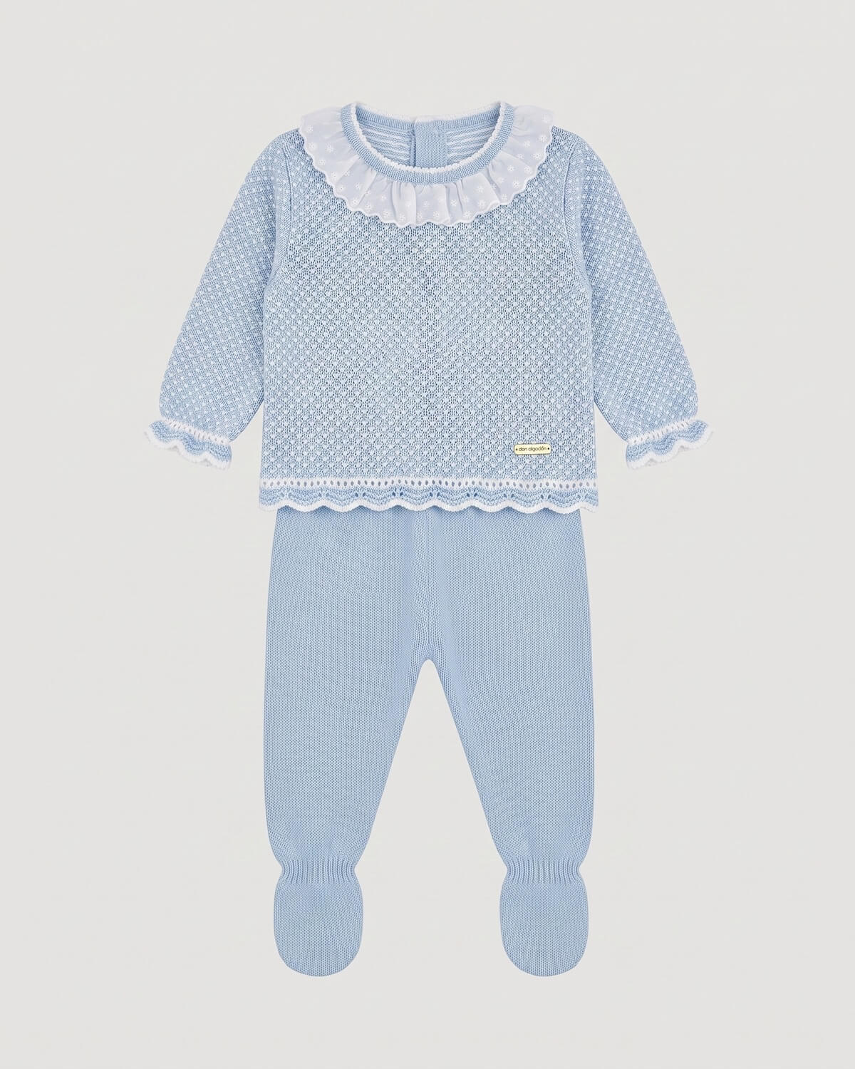 Don Algodon traditional Spanish two-piece knitted baby set with light blue jumper and matching footed leggings.