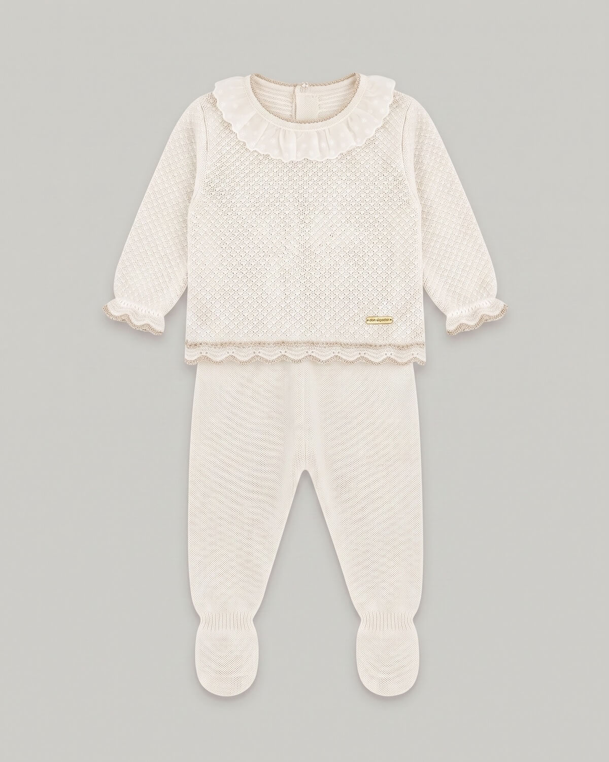 Don Algodon traditional Spanish two-piece knitted baby set with ivory beige jumper and matching footed leggings.