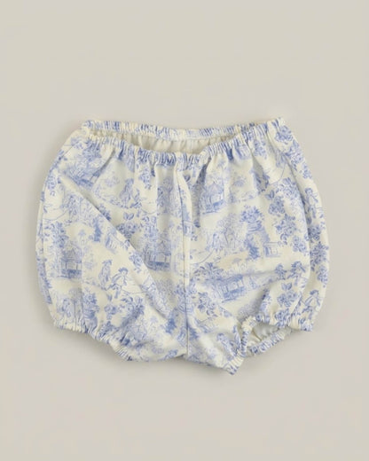 Detail view of traditional Spanish baby bloomers in blue and white toile de Jouy printed cotton fabric.