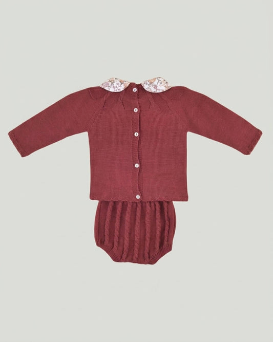 Back view of traditional Spanish baby burgundy knitted jumper with back button closure and cable knit bloomers.