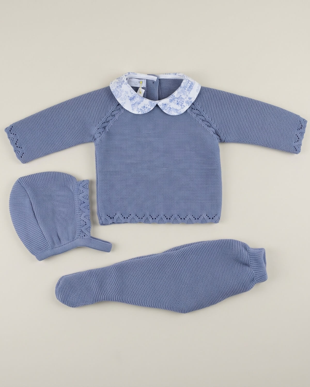 Dulce de Fresa traditional Spanish 3-piece knitted baby set with dusty blue jumper, toile de Jouy collar, footed leggings and bonnet.