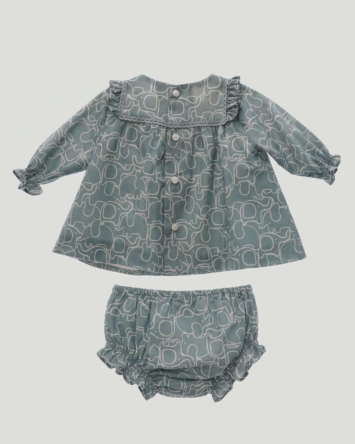 Back view of traditional Spanish baby dress featuring button closure and elasticated bloomers in duck green print.
