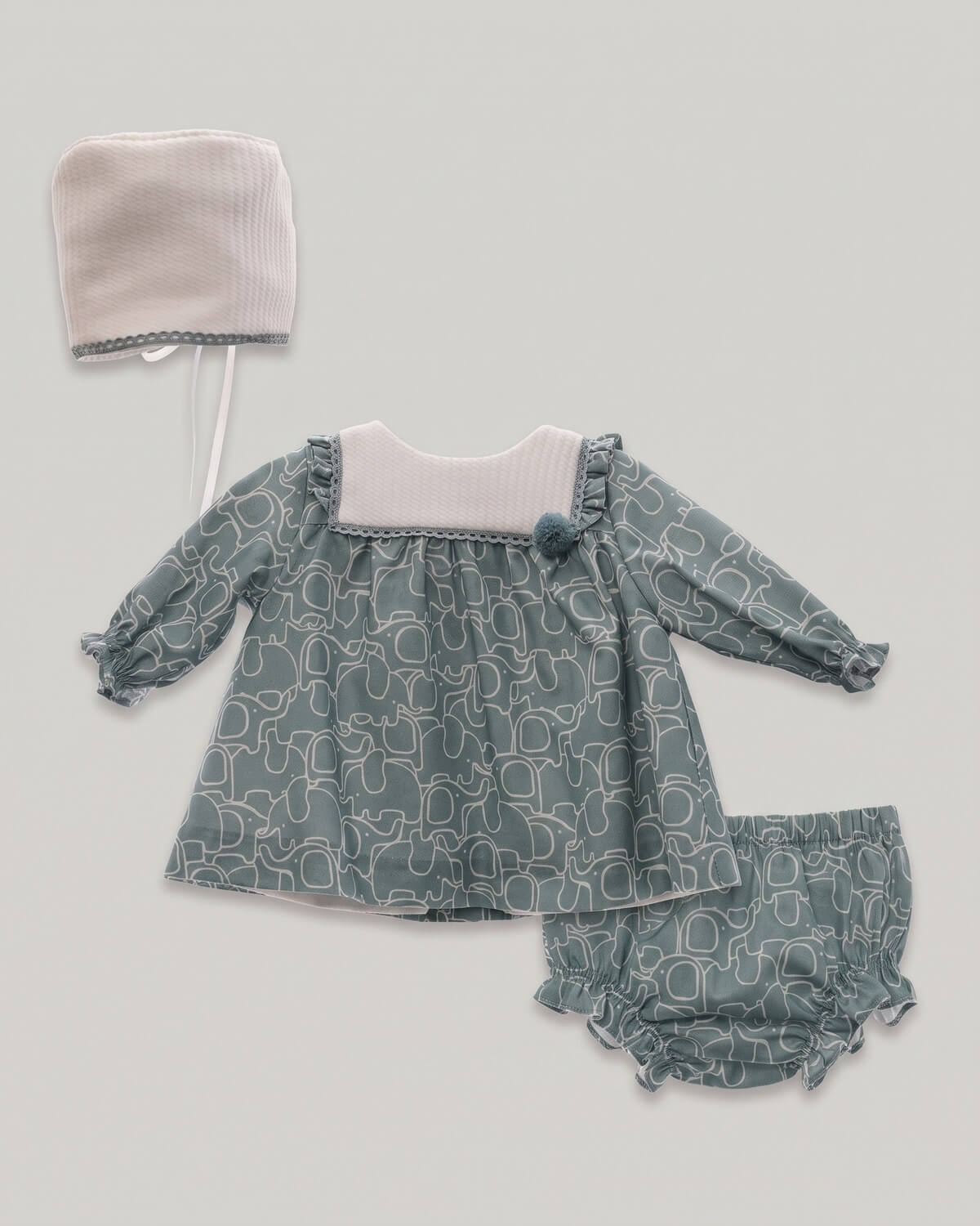 Micolino 3-piece traditional Spanish baby girl set including printed dress, matching bloomers and bonnet in duck green.